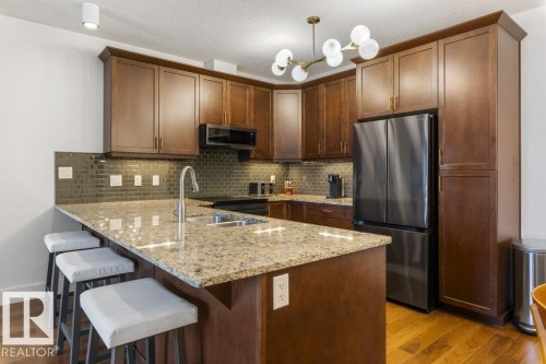 255 6079 Maynard Way, Edmonton, AB - Indoor Photo Showing Kitchen With Stainless Steel Kitchen With Double Sink With Upgraded Kitchen