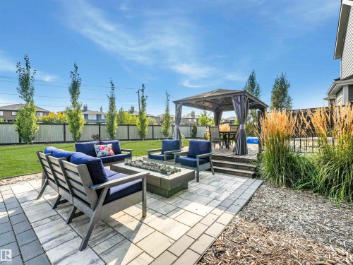 This backyard is an entertainer’s dream for three-season enjoyment — or your own peaceful private sanctuary. - 17703 9A Avenue, Edmonton, AB - Outdoor With Deck Patio Veranda