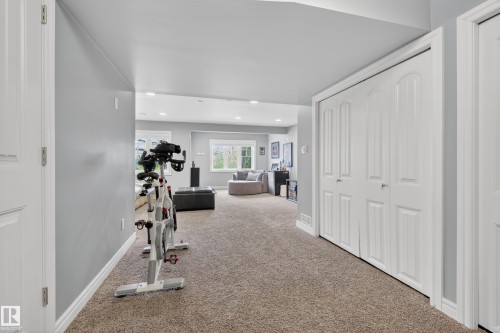 Expansive finished lower level featuring recessed lighting, light gray walls, and plush carpeting - 2146 Austin Link Link, Edmonton, AB - Indoor