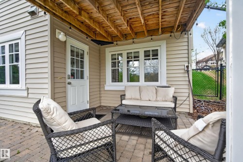 Covered outdoor patio with a paver stone surface - 2146 Austin Link Link, Edmonton, AB - Outdoor With Deck Patio Veranda With Exterior