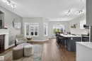 Open-concept living space with wood-finish flooring - 2146 Austin Link Link, Edmonton, AB  - Indoor With Fireplace 