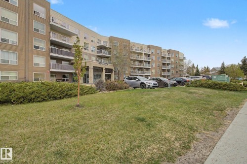 Multi-story condominium building featuring a contemporary design with balconies - 213 17404 64 Avenue, Edmonton, AB 