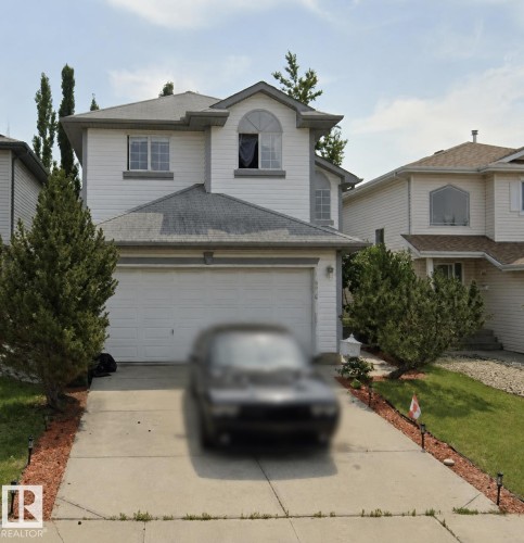 Two-story detached residence featuring white siding and a multi-pitch roof - 4019 37 Avenue, Edmonton, AB - Outdoor With Facade