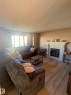 3927 160 Avenue, Edmonton, AB  - Indoor Photo Showing Living Room With Fireplace 