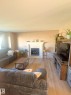 3927 160 Avenue, Edmonton, AB  - Indoor Photo Showing Living Room With Fireplace 