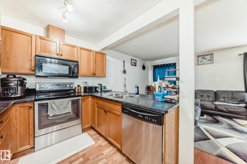 #38 150 Edwards Dr Sw, Edmonton, AB - Indoor Photo Showing Kitchen With Stainless Steel Kitchen With Double Sink
