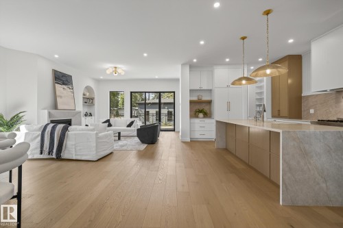 Open-concept living space with light wood-finish flooring - 13804 85 Avenue, Edmonton, AB - Indoor