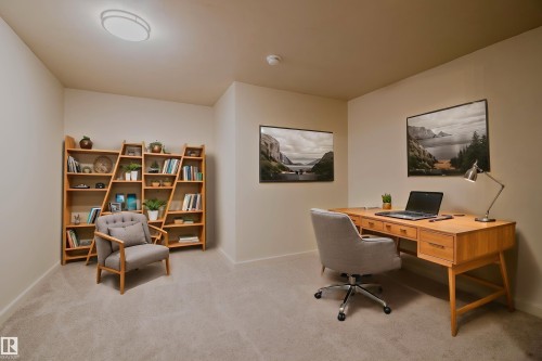 Versatile room featuring light-toned carpeting and neutral wall paint - 5935 189 Street, Edmonton, AB - Indoor Photo Showing Office