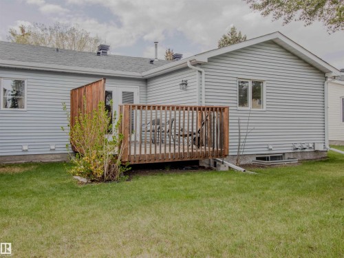 Exterior deck featuring wood construction and privacy screen - 5935 189 Street, Edmonton, AB - Outdoor With Deck Patio Veranda With Exterior