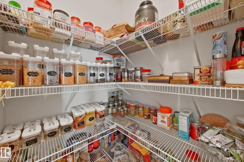 Corner pantry featuring wire shelving - 1231 Watt Drive, Edmonton, AB - Indoor With Storage