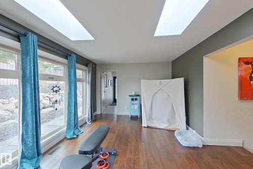 Room with wood-finish flooring and two rectangular skylights - 10 Brunswick Crescent, St. Albert, AB - Indoor