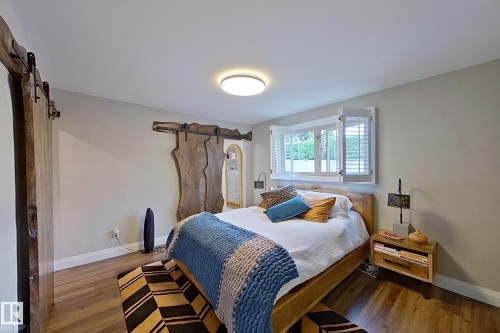 Wood-finish flooring throughout - 10 Brunswick Crescent, St. Albert, AB - Indoor Photo Showing Bedroom
