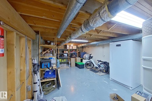 Unfinished basement with exposed wood joists and concrete flooring - 10 Brunswick Crescent, St. Albert, AB - Indoor Photo Showing Basement