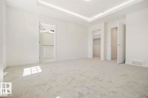 Spacious room featuring light gray carpet flooring and white walls - 151 Kidd Crescent, Leduc, AB - Indoor Photo Showing Other Room