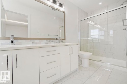 Dual vanity with quartz countertop and chrome fixtures - 151 Kidd Crescent, Leduc, AB - Indoor Photo Showing Bathroom