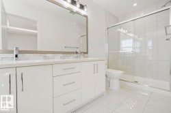 Dual vanity with quartz countertop and chrome fixtures - 
