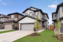 Contemporary two-story home featuring a grey and white exterior with dark trim - 151 Kidd Crescent, Leduc, AB  - Outdoor With Facade 
