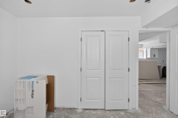 Freshly painted white walls with recessed ceiling light fixtures - 