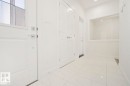 Entryway featuring bright white walls, large format tile flooring, and recessed lighting - 151 Kidd Crescent, Leduc, AB  - Indoor Photo Showing Other Room 
