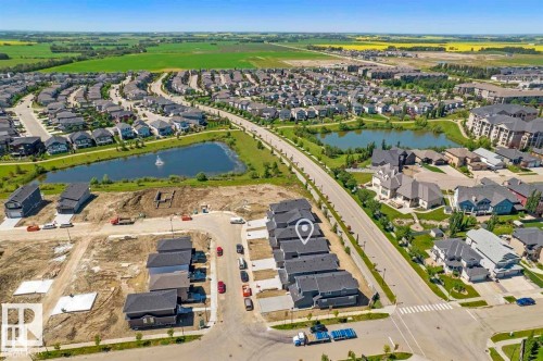 Developing residential area with numerous single-family homes and townhomes - 151 Kidd Crescent, Leduc, AB - Outdoor With View