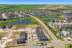 Developing residential area with numerous single-family homes and townhomes - 