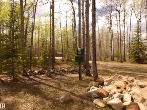Decorative rock project started; to line the driveway... - 307 Willow Place, Rural Barrhead County, AB 