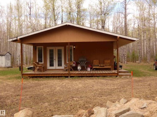 West facing, covered porch......calling you to come n' "set a spell" ! - 307 Willow Place, Rural Barrhead County, AB 