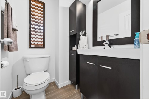 Bathroom featuring wood cabinets, tile flooring and white walls - 14522 56 Street, Edmonton, AB - Indoor Photo Showing Bathroom