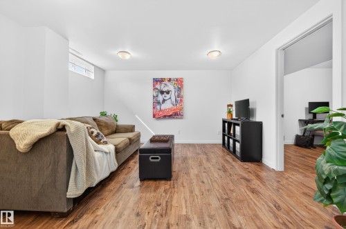 Recreation room featuring wood-finish flooring, white walls and lots of lighting - 14522 56 Street, Edmonton, AB - Indoor