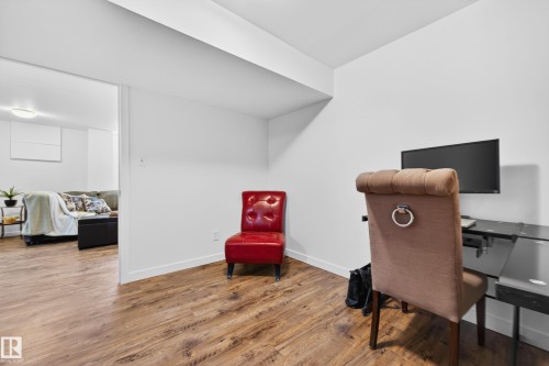 Dedicated office space featuring wood-look vinyl plank flooring and crisp white walls - 14522 56 Street, Edmonton, AB - Indoor Photo Showing Office