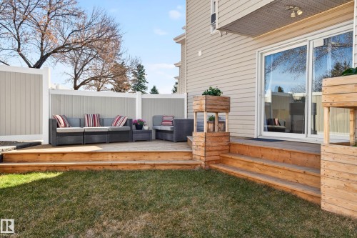 Expansive wood deck with multi-level design and built-in planters - 14522 56 Street, Edmonton, AB - Outdoor With Deck Patio Veranda