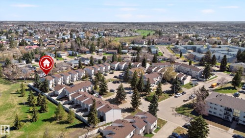 Aerial perspective of a multi-unit residential community featuring townhome-style residences with pitched roofs - 14522 56 Street, Edmonton, AB - Outdoor With View