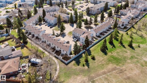Aerial perspective showcasing the complex with multi-unit residential buildings - 14522 56 Street, Edmonton, AB - Outdoor With View