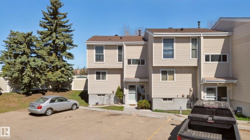 Areal view of front of structure highlighting the two parking stalls right outside the front door - 14522 56 Street, Edmonton, AB - Outdoor With Facade