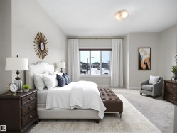 Spacious room featuring a large window, light-colored walls, and a textured ceiling - 