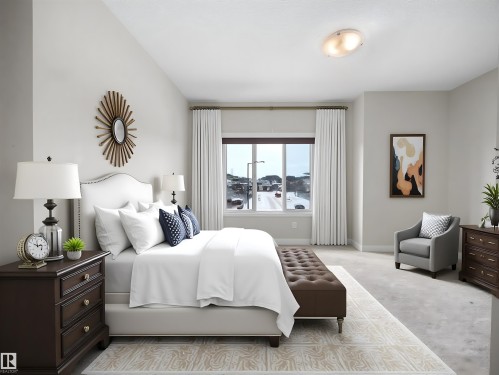 Spacious room featuring a large window, light-colored walls, and a textured ceiling - 8921 217 Street Nw, Edmonton, AB - Indoor Photo Showing Bedroom