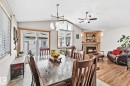 98 Hewitt Circle, Spruce Grove, AB  - Indoor Photo Showing Dining Room With Fireplace 