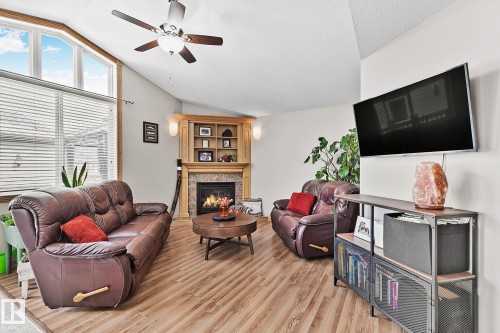 98 Hewitt Circle, Spruce Grove, AB - Indoor Photo Showing Living Room With Fireplace