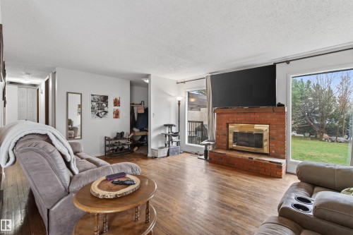 2012 2 Avenue, Cold Lake, AB - Indoor Photo Showing Living Room With Fireplace