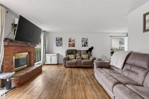 2012 2 Avenue, Cold Lake, AB - Indoor Photo Showing Living Room With Fireplace