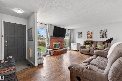 2012 2 Avenue, Cold Lake, AB - Indoor Photo Showing Living Room With Fireplace