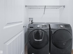 Dedicated laundry area with a wire shelving unit - 