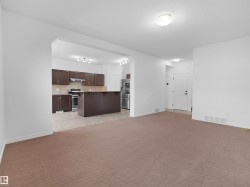 Spacious living area with carpet flooring - 