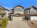 Two-story residence featuring light-colored siding and a two-car garage - 2017 32A Street, Edmonton, AB  - Outdoor With Facade 