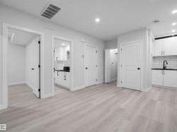 Light-toned wood-finish flooring throughout - 
