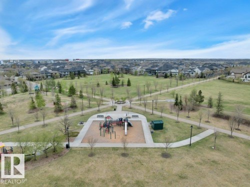 down the walking trail to Neighborhood PLAYGROUND - 1958 Ainslie Link, Edmonton, AB - Outdoor With View