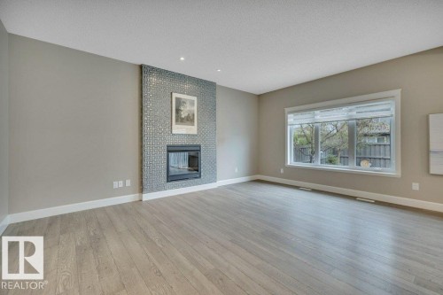1958 Ainslie Link, Edmonton, AB - Indoor Photo Showing Living Room With Fireplace