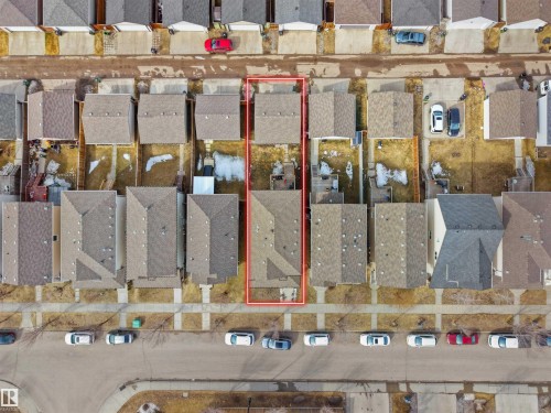 Aerial view of a residential property outlined in red, featuring a rectangular footprint - 5192 1B Ave Sw, Edmonton, AB - Indoor Photo Showing Basement
