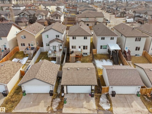 Aerial view of a residential neighborhood featuring multiple detached homes with attached garages - 5192 1B Ave Sw, Edmonton, AB - Outdoor
