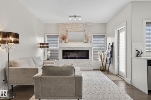 94 Tribute Common, Spruce Grove, AB - Indoor Photo Showing Living Room With Fireplace